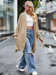 Camel open-stitch waffle knit duster cardigan with pockets and long sleeves.