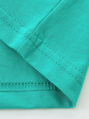Teal t-shirt detail showing hem and seam stitching.