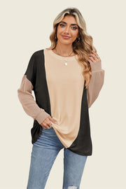 Colorblock waffle knit pullover with crew neck and long sleeves in tan, black, and rust.