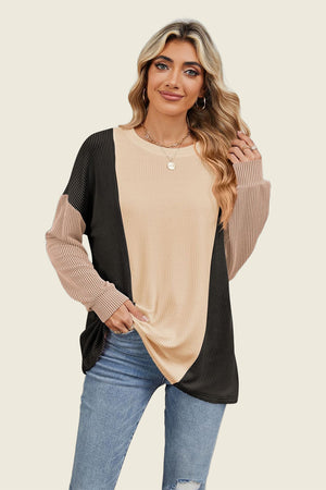 Colorblock waffle knit pullover with crew neck and long sleeves in tan, black, and rust.