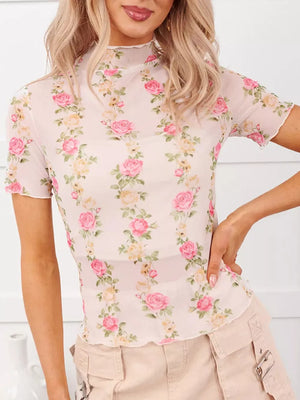 Sheer floral mesh shirt with short sleeves and ruffled mock neck.