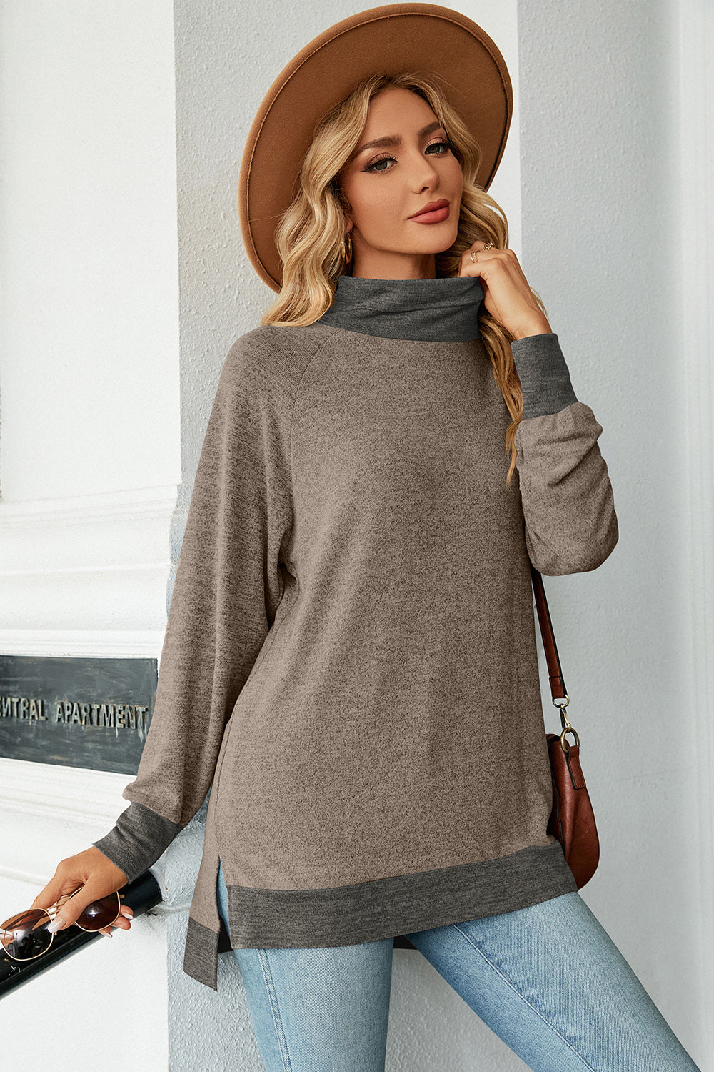 Colorblock raglan turtleneck tunic in mocha and dark gray with side slits.