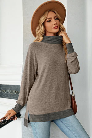 Colorblock raglan turtleneck tunic in mocha and dark gray with side slits.