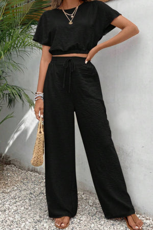 Black textured crop top and wide-leg drawstring trousers set