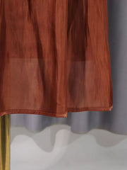 Brown sheer maxi dress hem with ruched detail and a gold mannequin stand.