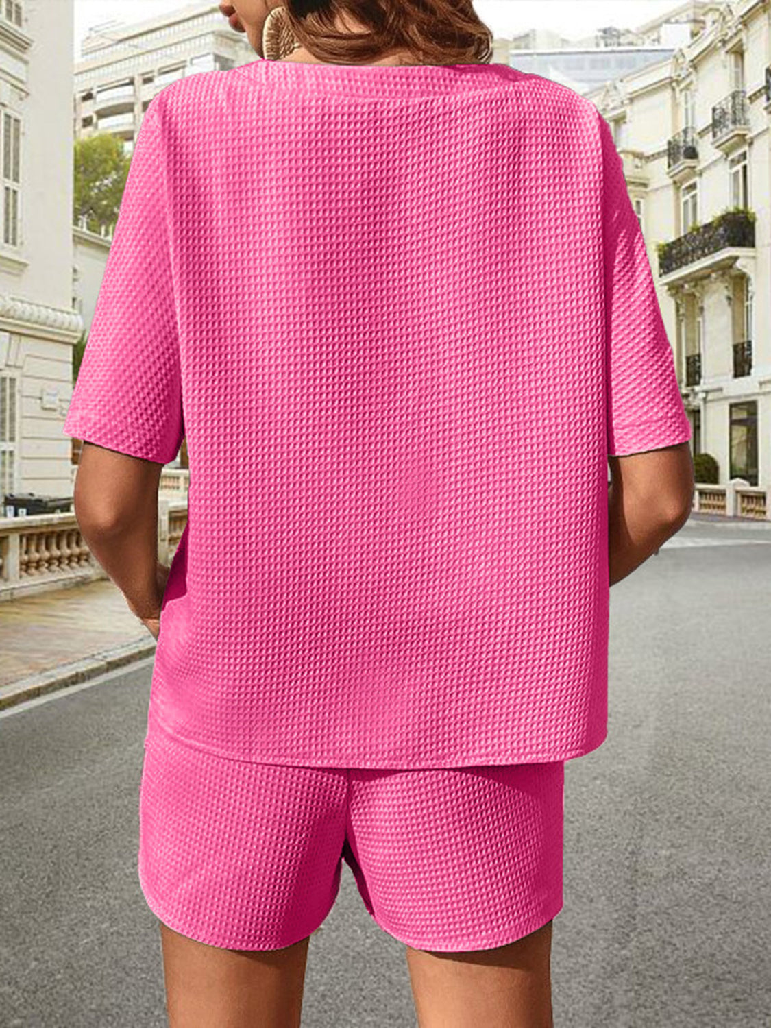 Pink waffle knit drawstring co-ord set with short sleeves and shorts.