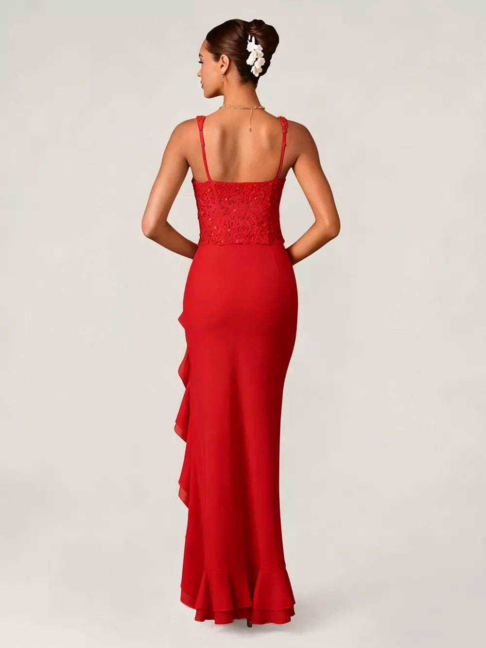 Deep red sequin ruffle maxi gown with spaghetti straps and a ruffled hem.