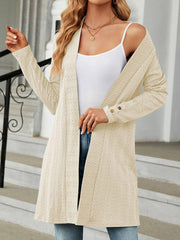 Textured knit longline cardigan in tan with button details on the cuffs.