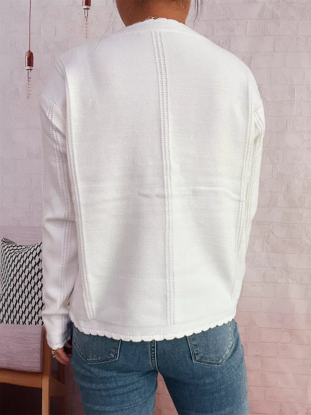 White button up cardigan with scalloped hem and vertical seam details.