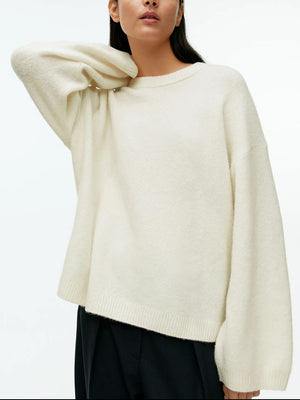 Oversized ivory brushed knit crewneck sweater with ribbed cuffs and hem.