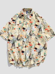 Tropical print oversized button-up shirt in tan with short sleeves and a casual fit.