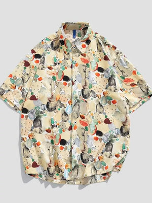 Tropical print oversized button-up shirt in tan with short sleeves and a casual fit.