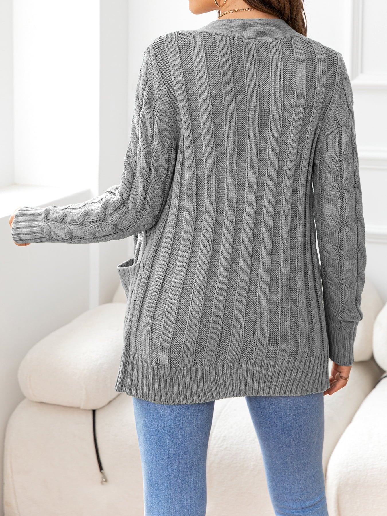 Heather Gray textured cable-knit cardigan with pockets and ribbed trim.