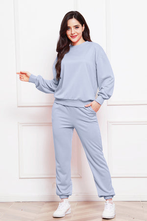 Light blue relaxed fit loungewear set with crewneck sweatshirt and jogger pants.