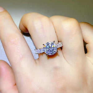Radiant round moissanite and baguette ring in silver sterling silver with 3 carat center stone.