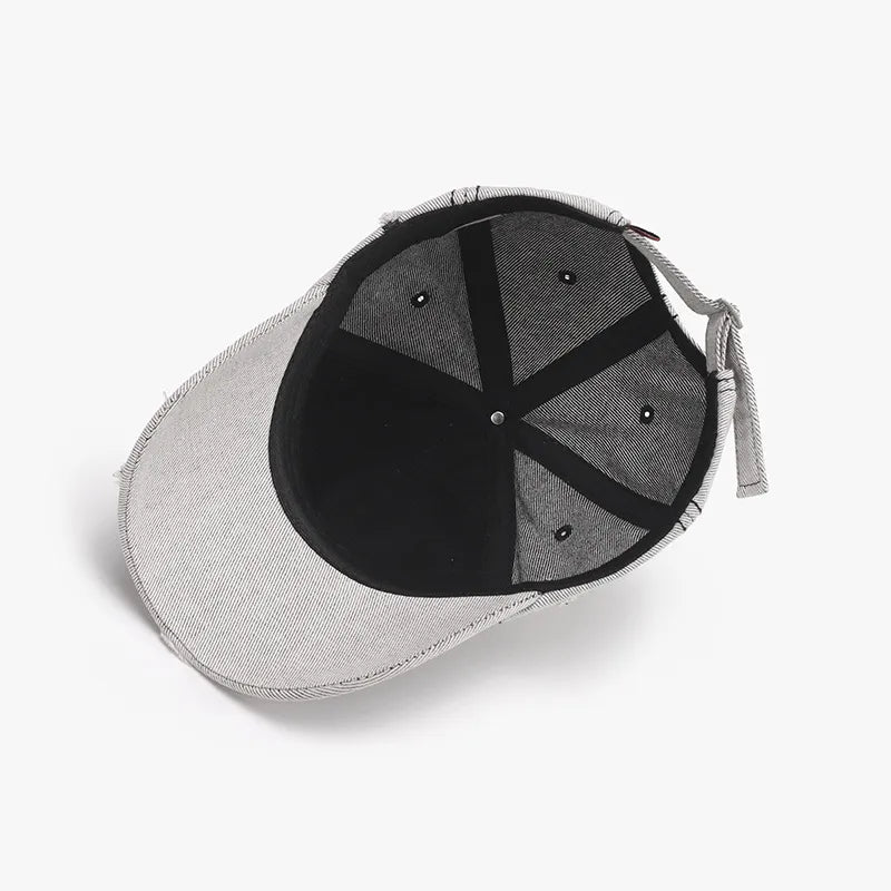 Distressed baseball cap with pinstripe pattern and adjustable strap.
