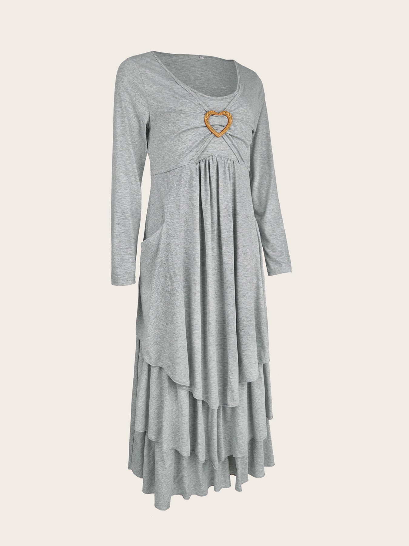 Light gray tiered midi dress with long sleeves, gathered bust, heart detail, and pockets.