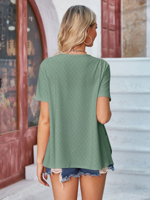 Sage perforated edge shawl collar jacket with short sleeves.
