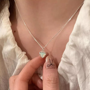 Charming heart pendant necklace in silver with opal stone detail
