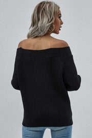 Black ribbed knit sweater with off-the-shoulder neckline and long sleeves.