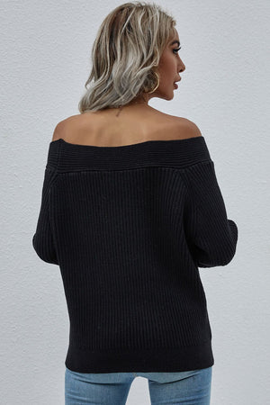 Black ribbed knit sweater with off-the-shoulder neckline and long sleeves.