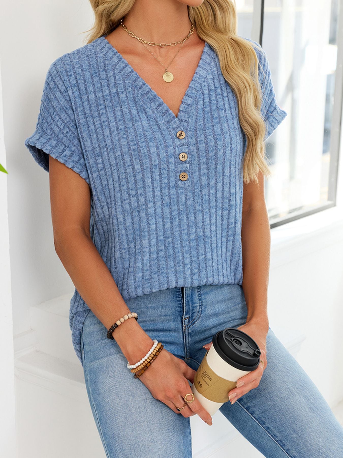 Light blue ribbed knit v-neck t-shirt with buttons and short sleeves