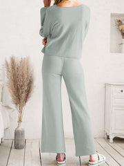 Light gray acrylic loungewear set with wide-leg pants and long-sleeve top.