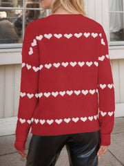 Scarlet knit sweater with white heart stripes, crew neck, long sleeves.