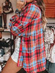 Oversized red plaid shacket with relaxed fit and button front, styled with denim shorts.