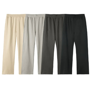 Seamed lounge trousers in beige, gray, dark gray, and black with a relaxed fit.