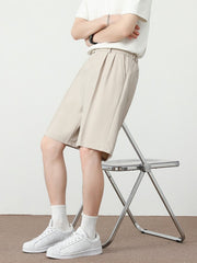 Cream pleated detail loose-fit chino shorts with a relaxed cut.