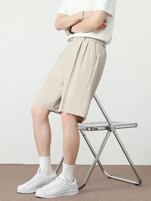 Cream pleated detail loose-fit chino shorts with a relaxed cut.