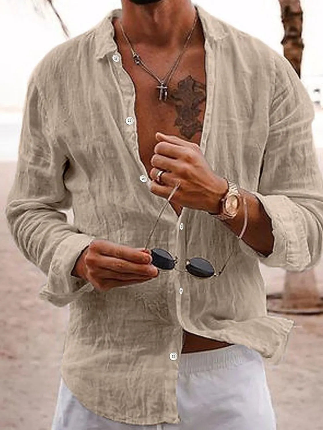 Khaki relaxed fit linen shirt with button front and collar, styled casually.
