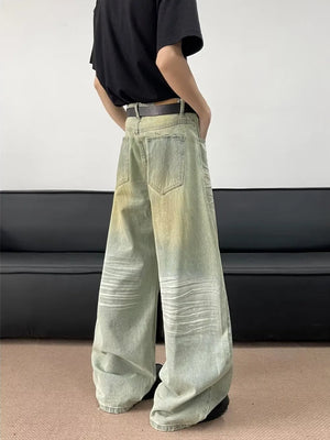 Men's oversized light blue jeans with creasing and faded details