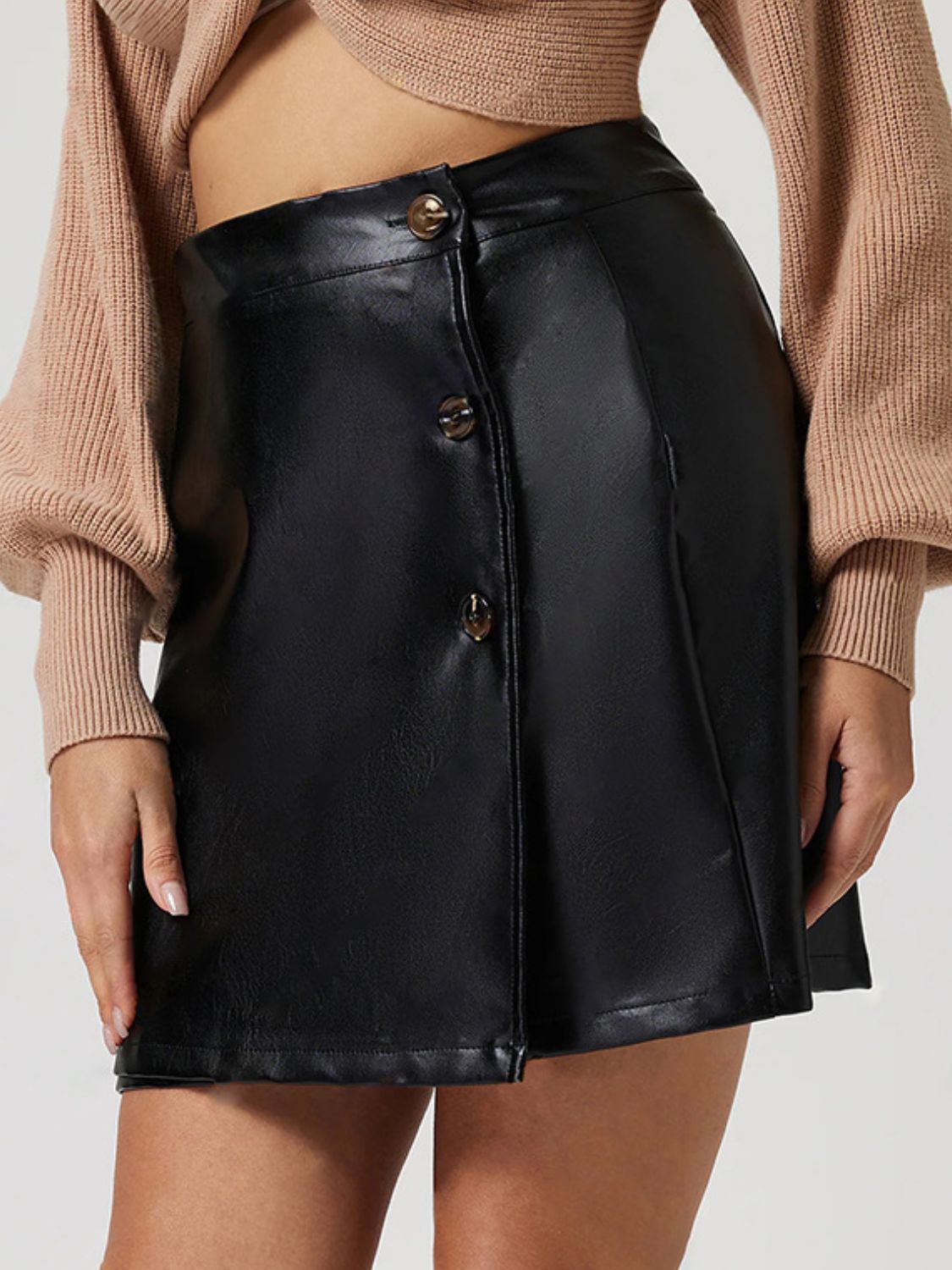 Black faux leather mini skirt with asymmetric button front detail