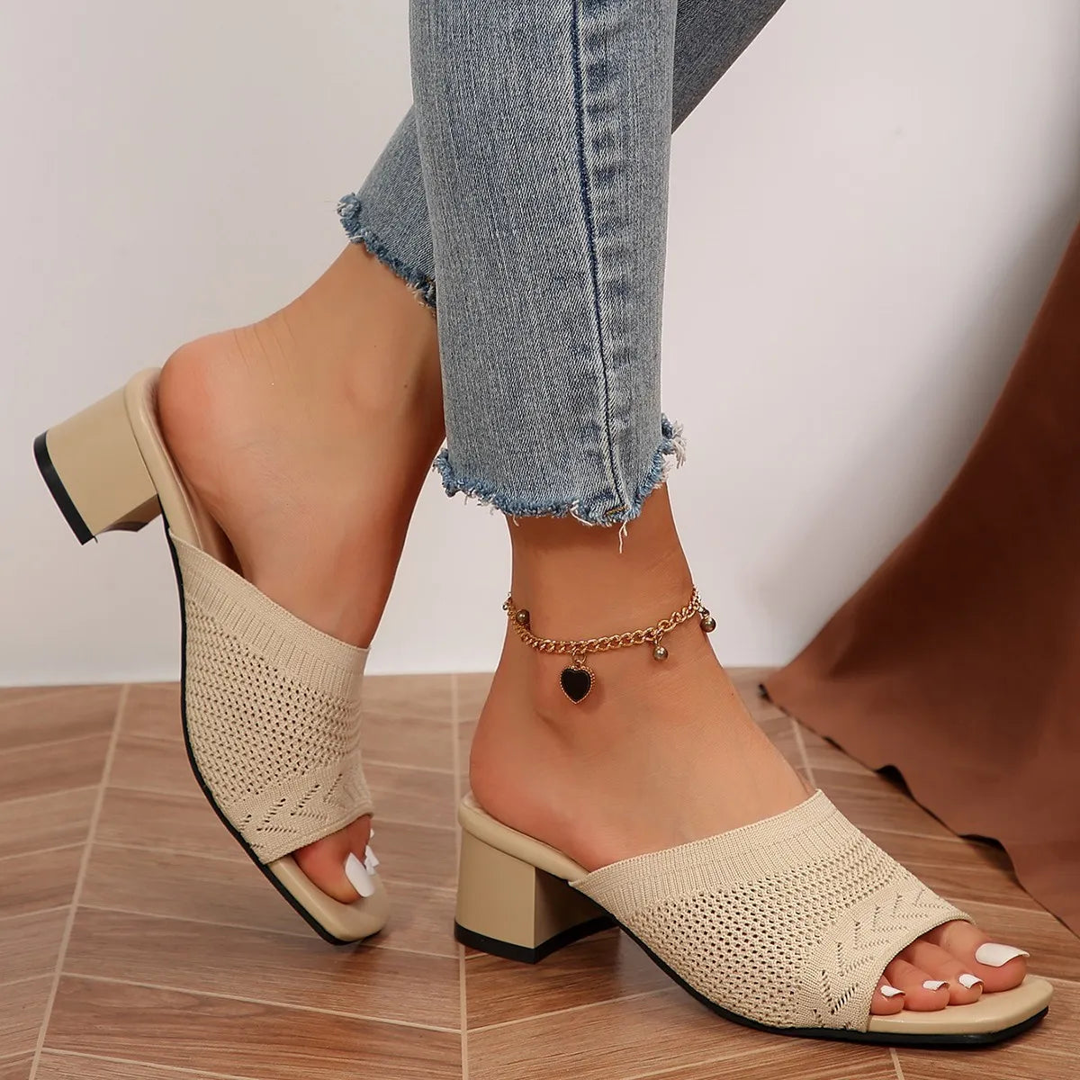 Khaki knit block heel mules with square toe and open back.