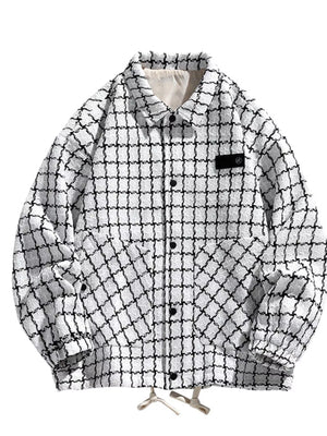 Oversized white plaid button-up jacket with black checks and two front pockets.