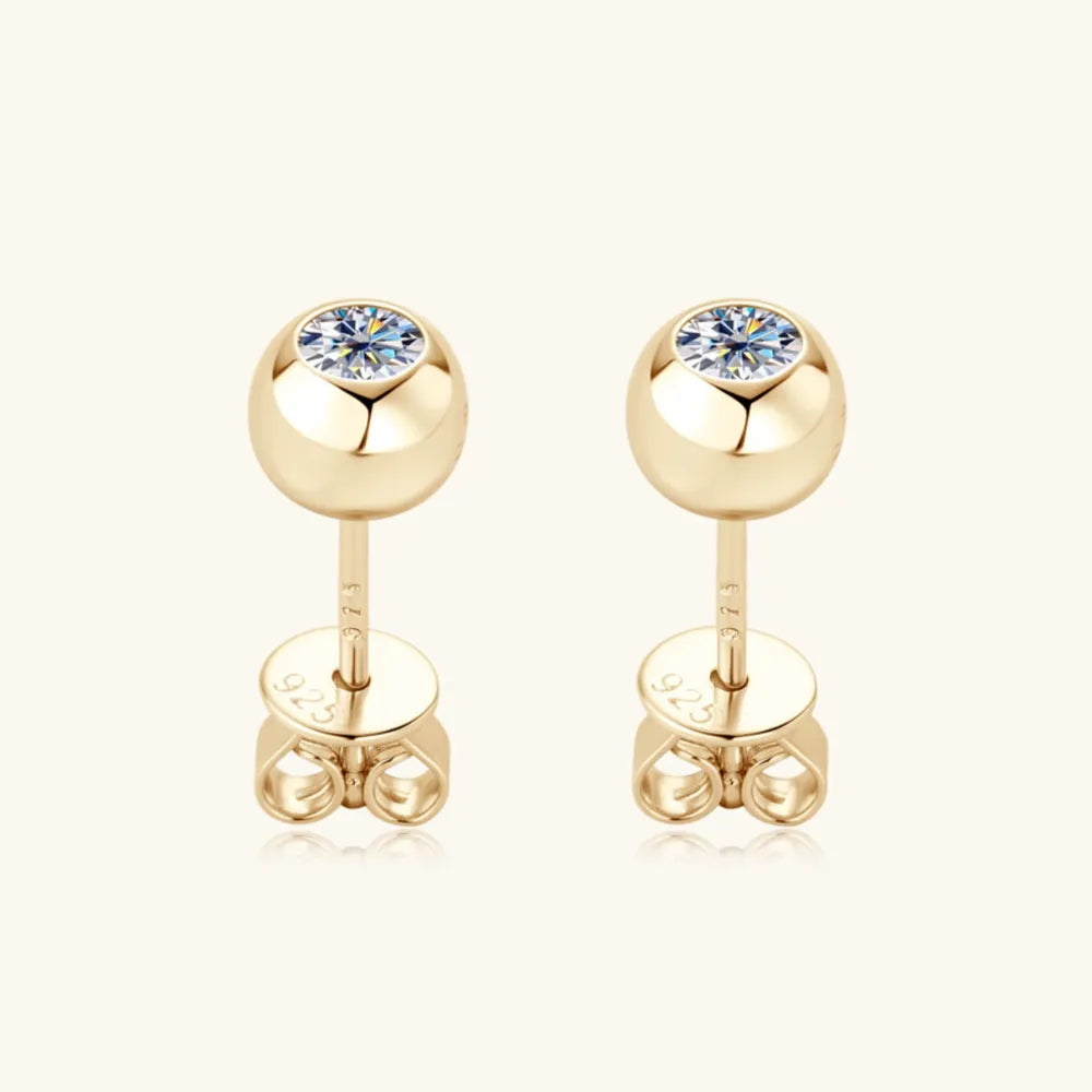 Gold bezel-set crystal stud earrings with 925 backing.