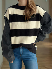 Denim sleeve stripe knit sweater with crew neck and long sleeves.