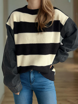 Denim sleeve stripe knit sweater with crew neck and long sleeves.
