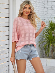 Openwork box stitch knit top in blush pink with short sleeves and a crew neck.
