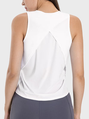 White cross-back performance tank top with a relaxed fit and open back detail.