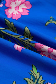 Tiered floral dress in blue with pink and green floral print, cotton fabric detail
