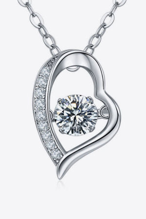 Silver heart pendant necklace with a dancing diamond and pave crystal accents.