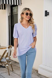 Perforated puff sleeve v-neck top in lavender with eyelet details.