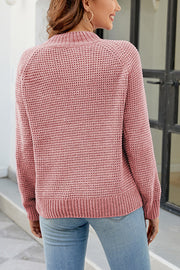 Blush pink waffle knit raglan sleeve pullover sweater with mock neck and ribbed cuffs and hem.