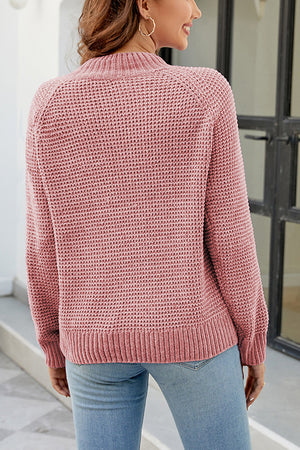 Blush pink waffle knit raglan sleeve pullover sweater with mock neck and ribbed cuffs and hem.