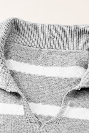 Light gray and white striped knit pullover sweater with a wide collar and V-neck detail.