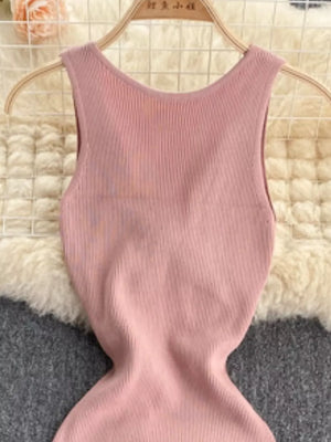 Pink ribbed knit bodycon midi dress with a scoop neck and sleeveless design.