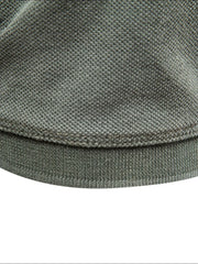 Sage textured polo shirt hem detail with ribbed band